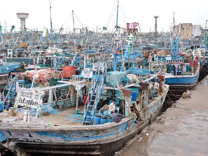 boats are anchored at the karachi fish harbour after government s advice to fishermen not to venture into the sea photo jalal qureshi express boats are anchored at the karachi fish harbour after government s advice to fishermen not to venture into the sea photo jalal qureshi express
