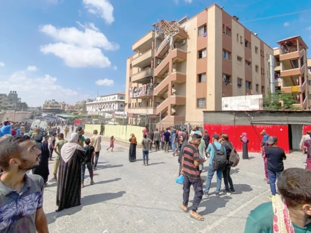 palestinians gather outside nasser hospital in khan yunis in gaza strip following israeli strikes photo afp