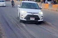 built to break cars take a hazardous ride over the newly opened stretch where uneven surfaces and early signs of sinking have raised safety concerns photo express