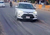 built to break cars take a hazardous ride over the newly opened stretch where uneven surfaces and early signs of sinking have raised safety concerns photo express