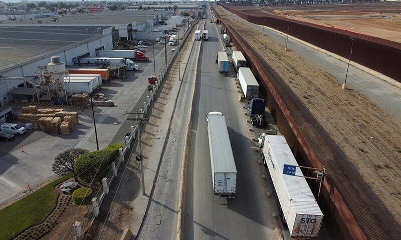 a drone view shows trailer trucks queuing to cross into the united states at the otay mesa port of entry in tijuana mexico on november 27 2024 photo reuters