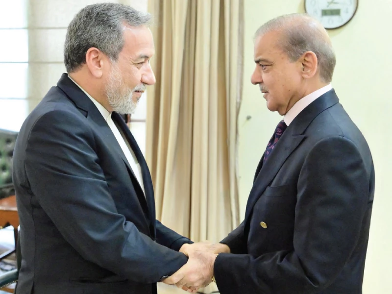 pm shehbaz sharif shakes hands with iranian fm abbas araghchi during a meeting in islamabad photo express pm shehbaz sharif shakes hands with iranian fm abbas araghchi during a meeting in islamabad photo express