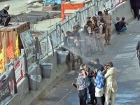 a volunteer sprays water on mourners as they take part in the procession offering much needed relief from the intense heat while ensuring comfort amid the solemn gathering photo jalal qureshi express