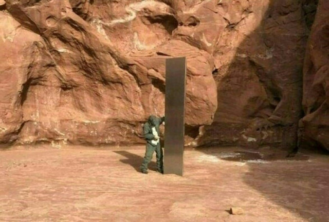 this mysterious metal monolith was discovered in utah after public safety officers spotted the object while conducting a routine wildlife mission on november 18 photo afp this mysterious metal monolith was discovered in utah after public safety officers spotted the object while conducting a routine wildlife mission on november 18 photo afp