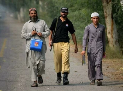 two policemen killed in militant attack on polio team in k p attackers shot dead
