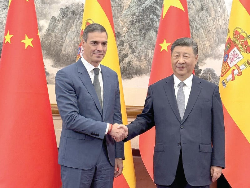 spain s prime minister pedro sanchez shakes hands with china s president xi jinping during his visit to beijing photo afp