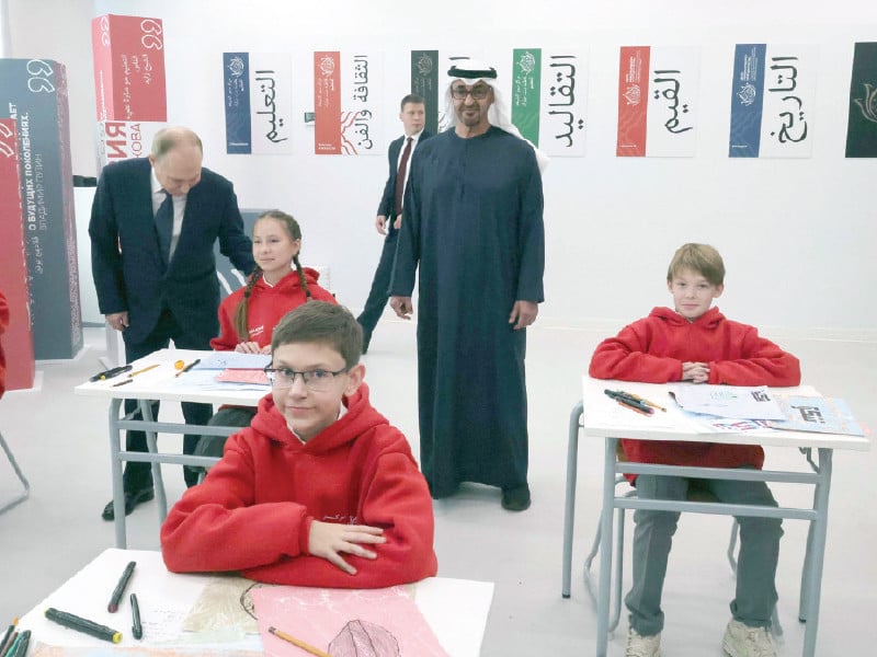 russia s president vladimir putin and uae president sheikh mohamed bin zayed bin sultan al nahyan attend the opening of the sheikha fatima bint mubarak education centre at primakov school in razdory outside moscow photo afp