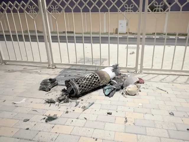 this frame grab shows the remnants of an iranian missile intercepted over qatar as it lies on a pavement near a fence photo afp this frame grab shows the remnants of an iranian missile intercepted over qatar as it lies on a pavement near a fence photo afp