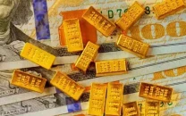 gold steady in range as global pressure persists