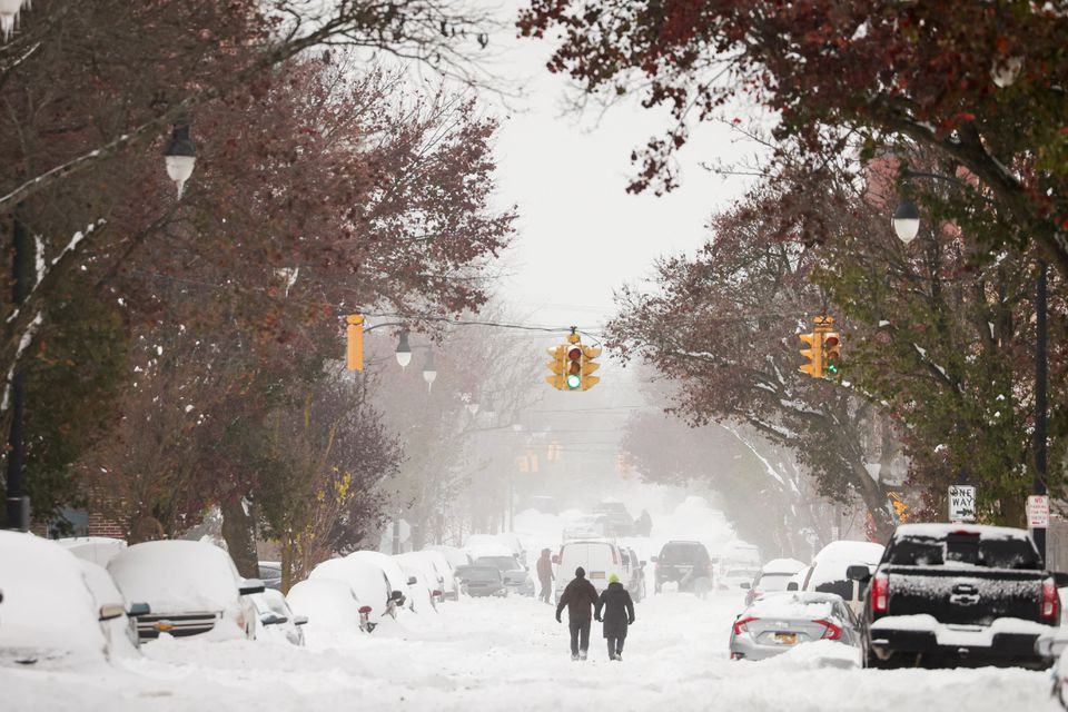 stranded cars are seen on the street during a snowstorm as extreme winter weather hits buffalo new york u s november 19 2022 reuters lindsay dedario