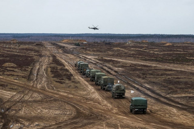 a helicopter flies over troops during the joint military drills of the armed forces of russia and belarus at a firing range in the brest region belarus february 19 2022 vadim yakubyonok belta handout via reuters a helicopter flies over troops during the joint military drills of the armed forces of russia and belarus at a firing range in the brest region belarus february 19 2022 vadim yakubyonok belta handout via reuters