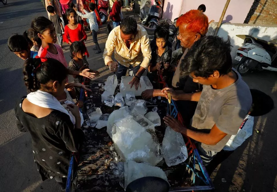 a man breaks a block of ice to distribute it among the residents of a slum during hot weather in ahmedabad india april 28 2022 reuters a man breaks a block of ice to distribute it among the residents of a slum during hot weather in ahmedabad india april 28 2022 reuters
