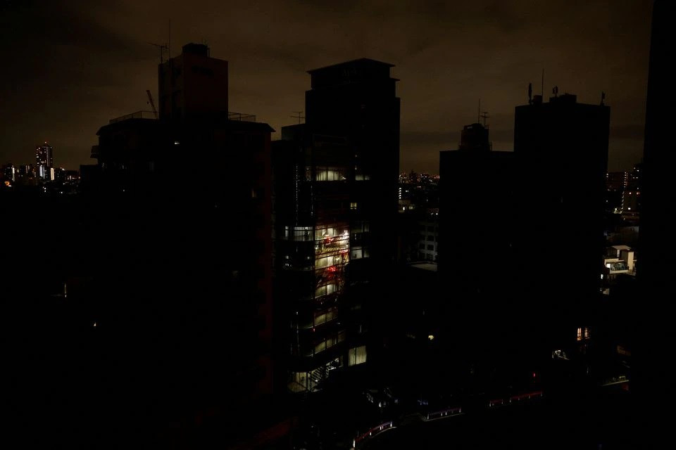 houses and buildings are seen in an electric stoppage at the area after an earthquake at toshima ward in tokyo japan march 17 2022 photo reuters