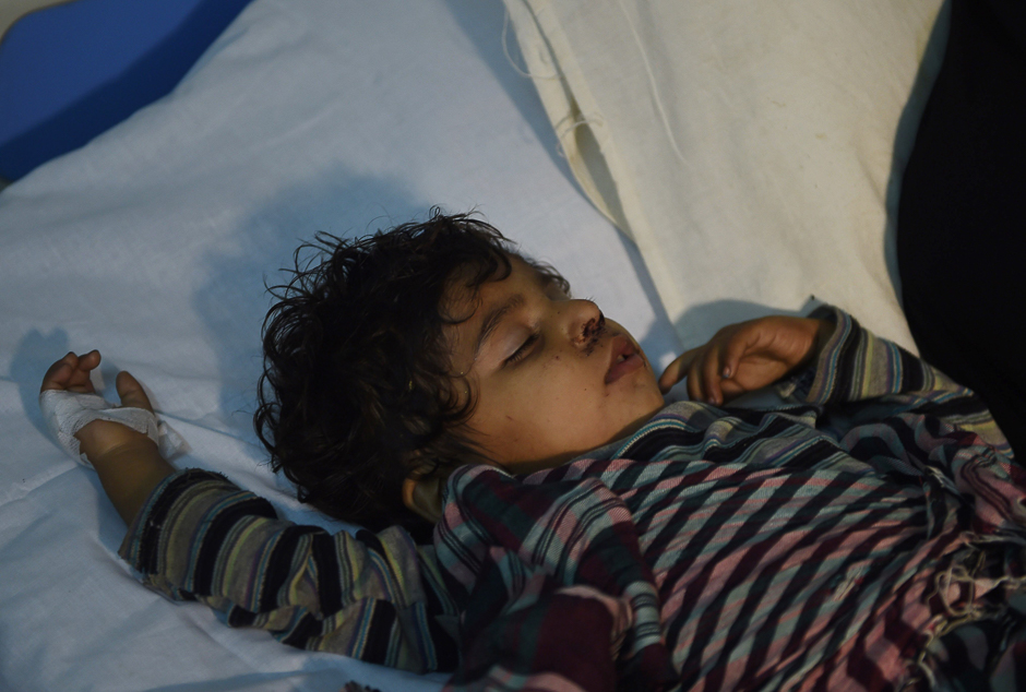 an injured child is treated at a local hospital in the town of sehwan a day after the bomb attack photo afp