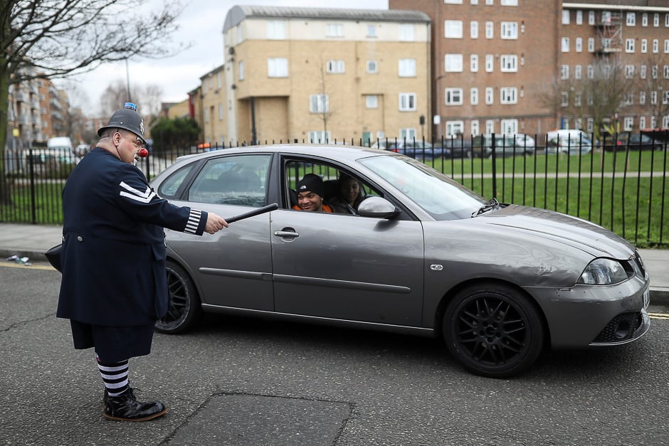 An entertainer attempts to direct traffic as he attends an annual service of remembrance in honour of British clown Joseph Grimaldi, at All Saints Church in Haggerston, London, Britain. PHOTO: REUTERS