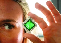 a christie s employee poses with emerald photo afp