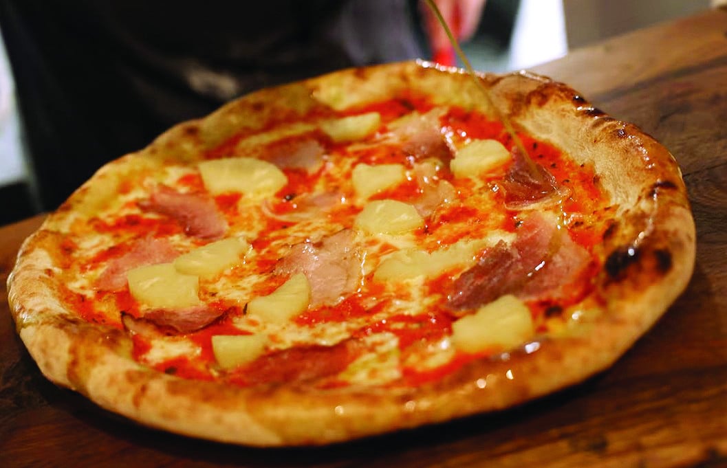 hawaiian pizza is topped with pineapple photo reuters