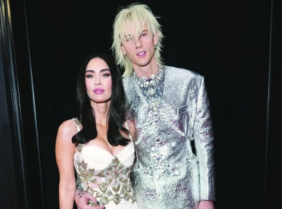 mgk shares rare photo of baby daughter saga blade to mark album anniversary