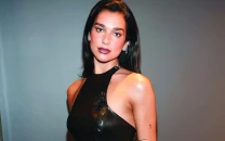 dua lipa spotted supporting arsenal during champions league match against real madrid at emirates stadium dua lipa spotted supporting arsenal during champions league match against real madrid at emirates stadium