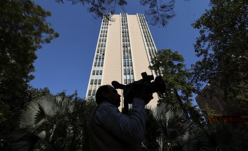 a cameraman works outside a building having bbc offices where income tax officials are conducting a search in new delhi india february 14 2023 reuters anushree fadnavis