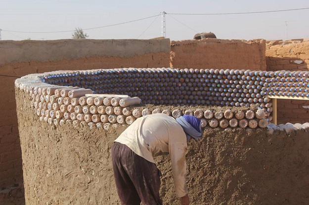 Breica is using plastic bottles to build homes for other refugees living in the desert camp. PHOTO: FACEBOOK