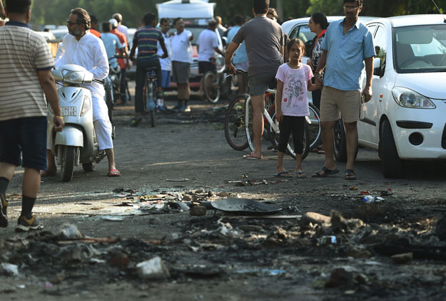 Scorch marks from items set on fire are seen on a road in Panchkula on August 26, 2017. PHOTO: AFP 