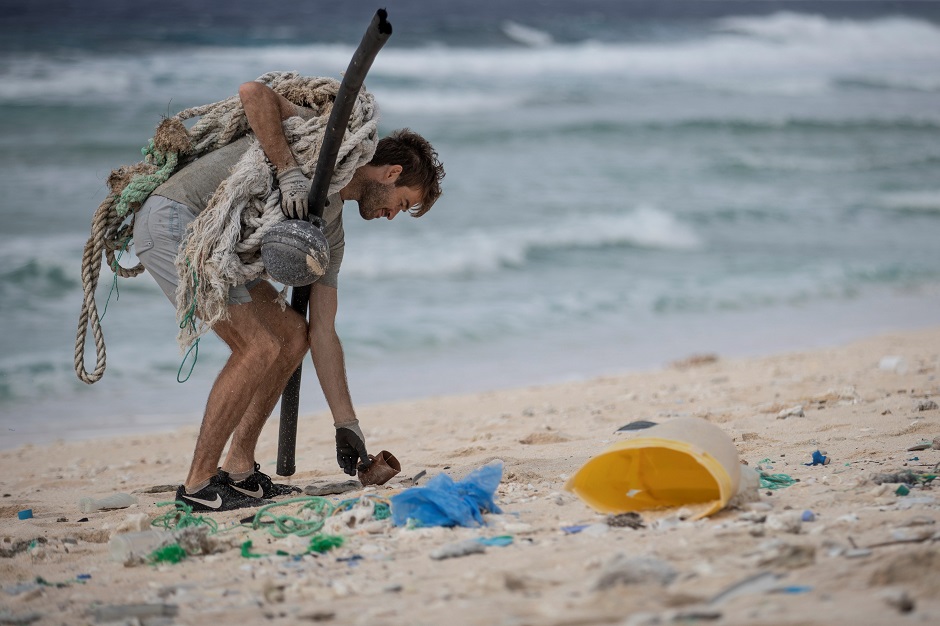 This picture shows a masked booby walking amongst rubbish at the high-tide mark on a beach on Henderson Island, an uninhabited member of the Pitcairn Islands archipelago in the South Pacific Ocean. PHOTO: AFP