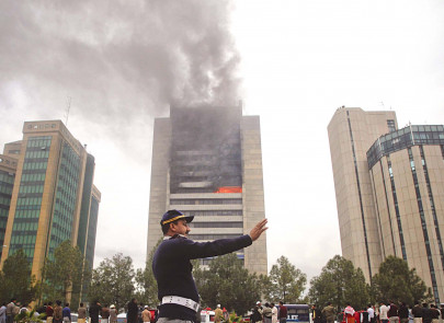 high rise inferno in the charred remains rescue workers find a body