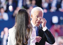 emotional biden passes torch to harris