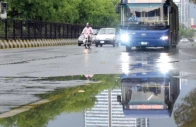 puddles along jinnah avenue mirror the refreshed greenery as rain brings welcome relief from the heat in the federal capital photo online