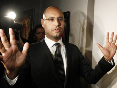qaddafi s detained son needs lawyer rights group