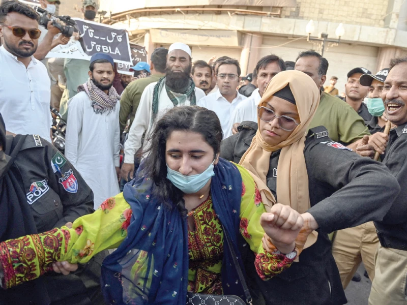 police detain an activist from the baloch yakjehti committee during a protest in karachi demanding the release of the group s chief organiser mahrang baloch along with other allegedly missing baloch persons photo afp police detain an activist from the baloch yakjehti committee during a protest in karachi demanding the release of the group s chief organiser mahrang baloch along with other allegedly missing baloch persons photo afp