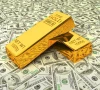 strong dollar rising yields push gold lower