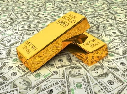 strong dollar rising yields push gold lower