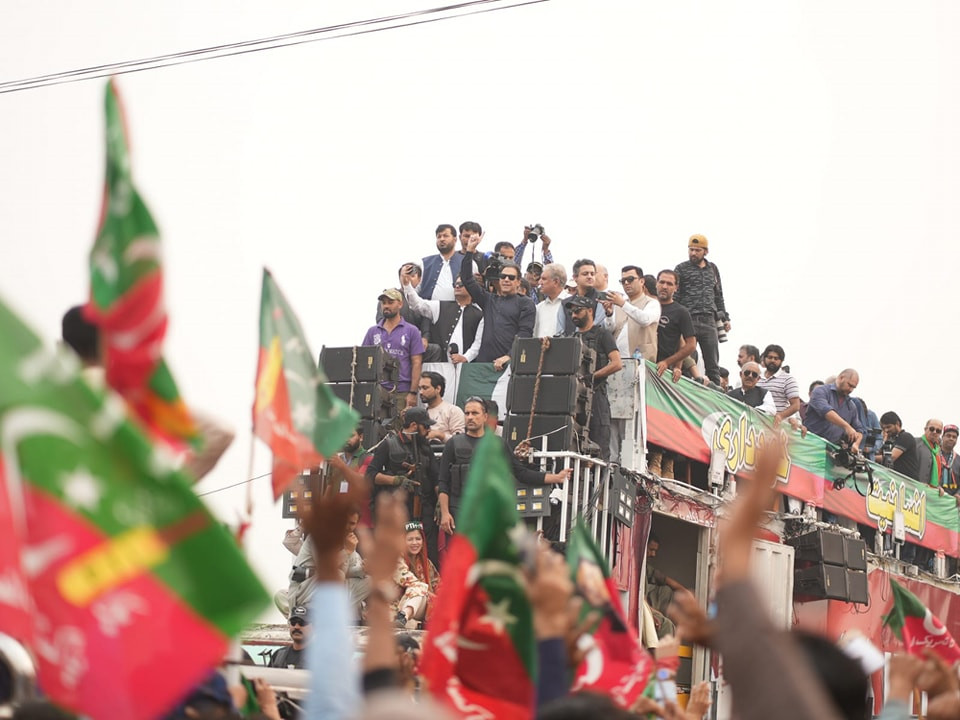 picture shows pakistan tehreek e insaf pti chairman imran khan with close aides on his open top container during the pti s long march photo facebook pti