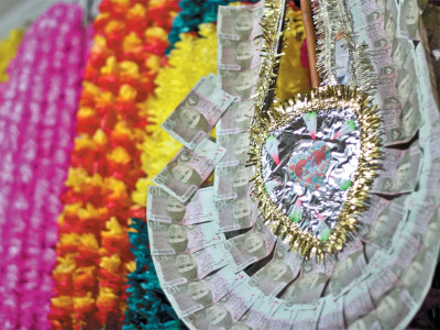 cutting back on luxuries wreaths of money