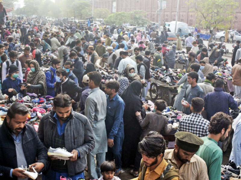 ignoring safety protocols people flock to a flea market selling used shoes in the provincial capital as covid 19 claims 17 more lives in punjab the government has imposed smart lockdowns in four major districts to contain the pandemic photo online