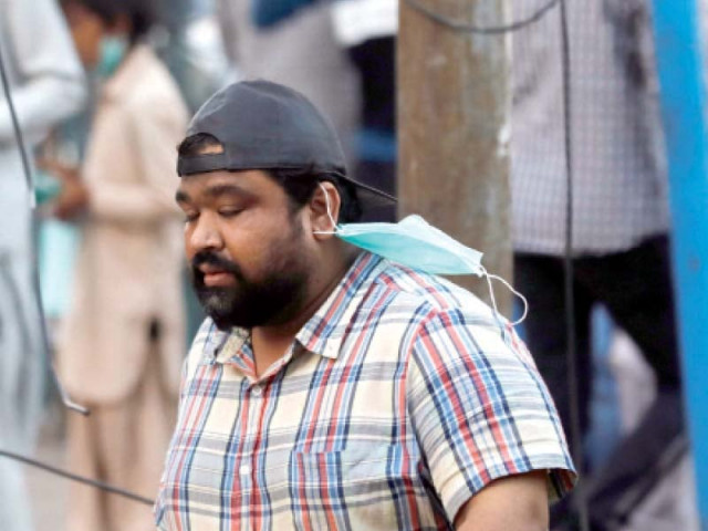 a man walks in a market unbothered by his mask flying to the side health officials have ascribed the rise in covid 19 cases to citizens refusal to follow sops photo reuters a man walks in a market unbothered by his mask flying to the side health officials have ascribed the rise in covid 19 cases to citizens refusal to follow sops photo reuters