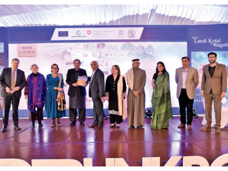 speakers at the book launch ceremony held at the pnca line up for a photo opportunity with the author salman rashid photo online