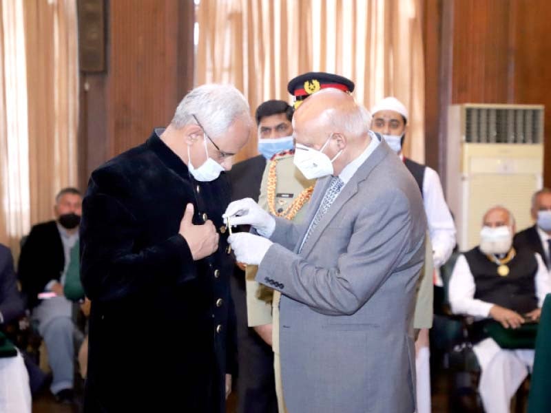 punjab governor chaudhry sarwar confers tamgha i imtiaz on government college university lahore vice chancellor dr asghar zaidi for his contributions in the field of research and education photo express