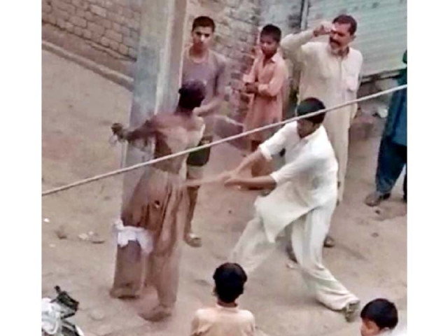 people tied a differently abled youth to a pole in tandlianwala and tortured him on suspicion of theft photo express people tied a differently abled youth to a pole in tandlianwala and tortured him on suspicion of theft photo express
