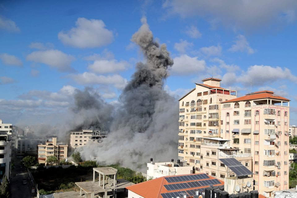 Smoke rises following an Israeli air strike, amid a flare-up of Israeli-Palestinian fighting, in Gaza City May 17, 2021. PHOTO: REUTERS