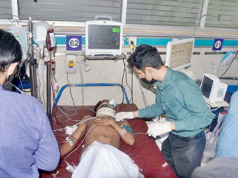 a medical team treats a man injured in a blast that occurred in johar town s allah hoo boulevard television footage of the fatal explosion showed visible damage to nearby houses whose walls had collapsed and window panes shattered photo app abid nawaz express