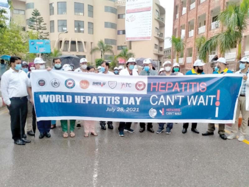 the faculty members and students of rawalpindi medical university took part in a walk organised to mark world hepatitis day photo express