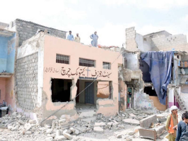 kmc teams razed a portion of the only remaining church in sadiq nagar area on tuesday no one cares for our protests no one actually counts us as people lamented one elderly resident photo ppi