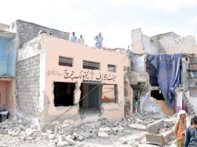 kmc teams razed a portion of the only remaining church in sadiq nagar area on tuesday no one cares for our protests no one actually counts us as people lamented one elderly resident photo ppi