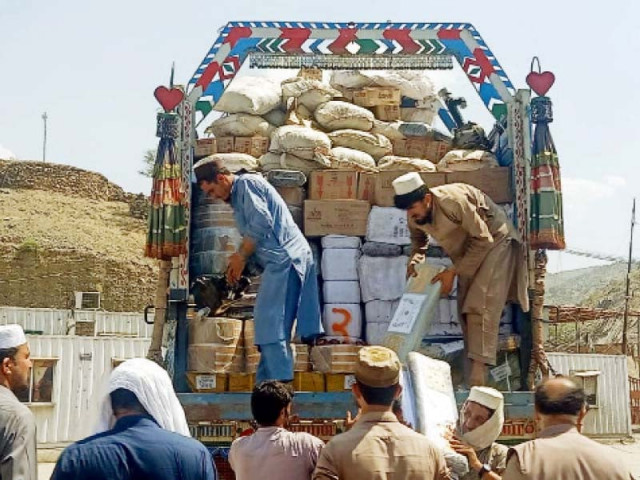 custom officials inspect smuggled goods seized during an operation at torkham border at landi kotal photo ppi