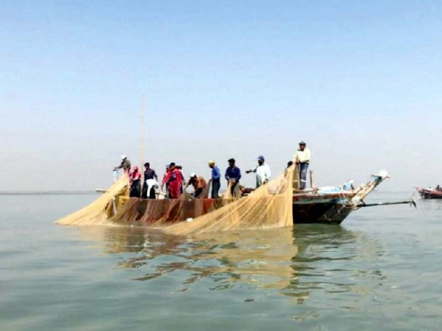 fishermen haul in a net on their boat photo anadolu agency fishermen haul in a net on their boat photo anadolu agency