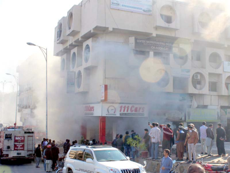 rescue teams attempt to extricate people from the fire ravaged ghousia plaza in the capital s blue area photo express