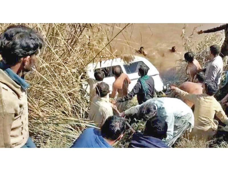 people attempt to rescue passengers from a van that plunged into a canal rescue teams arrived on the scene soon after the accident photo express